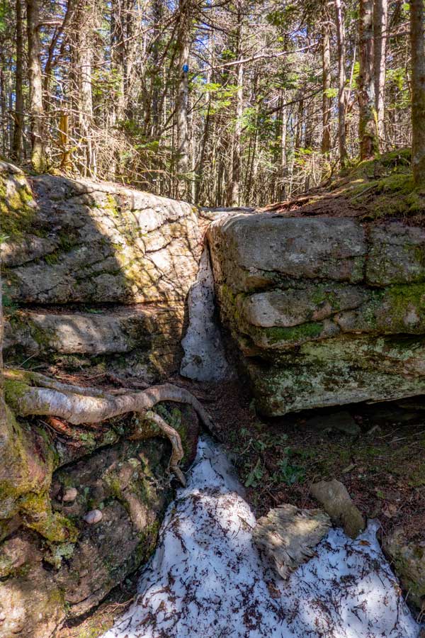 small V Shaped climb up ledge rock near the summit of Peekamoose Mountain