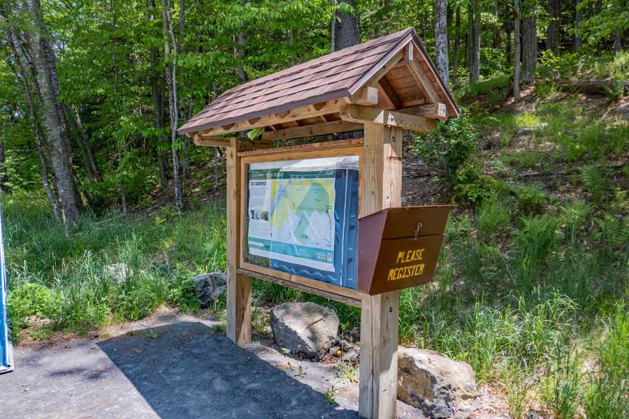 Red Hill Fire Tower parking area kiosk and DEC registration box for this hike