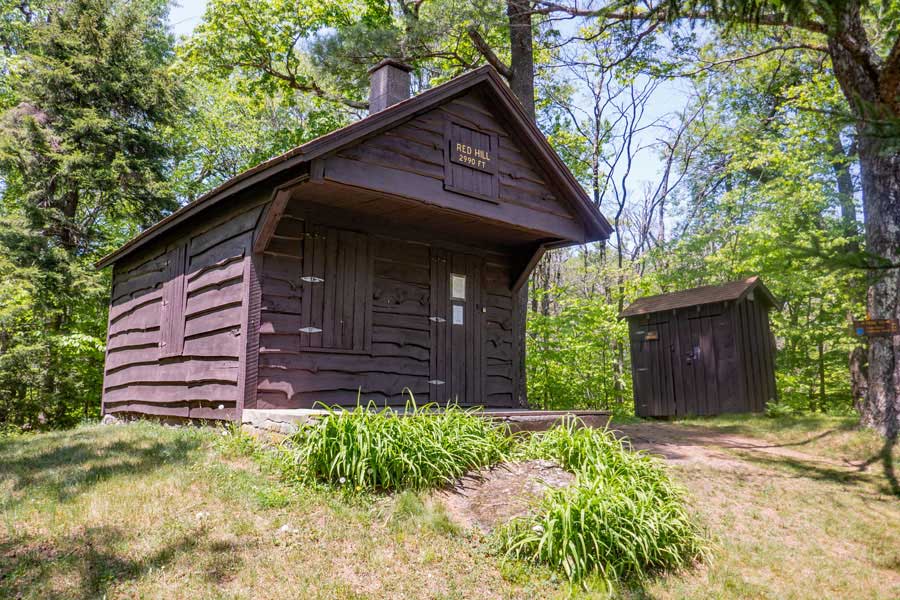 Red Hill Fire Tower Ranger Station and outhouse