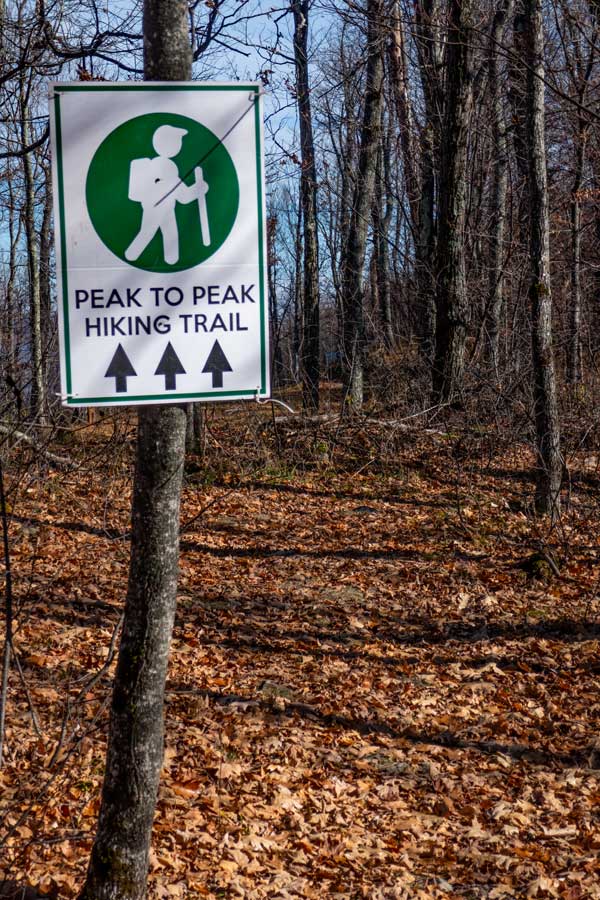 Sign showing the Trailhead to the Peak-to-Peak Hiking Trail
