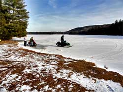 snowmobiling on north-south lake in the catskill mountains